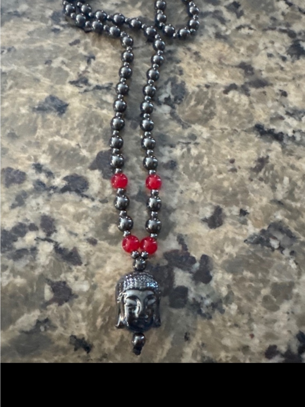 Hematite Bead Necklace with Red Accent and Buddha Pendant$6.00